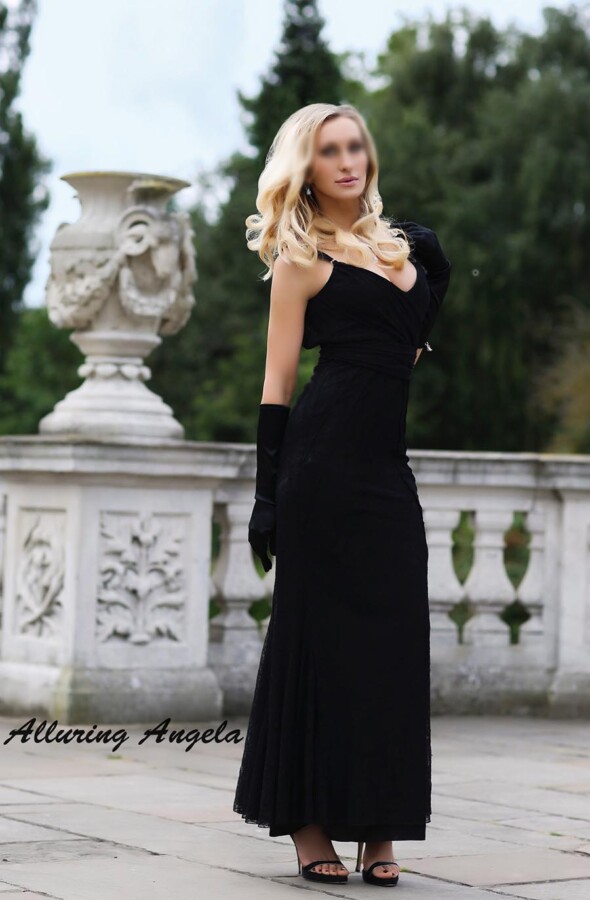 Mature blonde in black evening dress and gloves